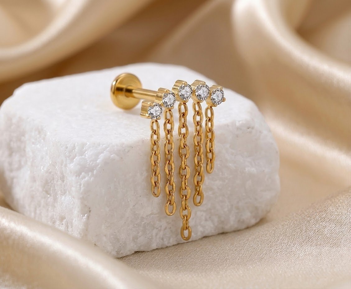 Dangling marquise stud earring with a marquise-cut stone.