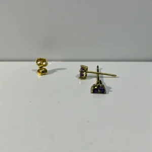 Triangle crystal clear ear stud with geometric design and polished metal setting.