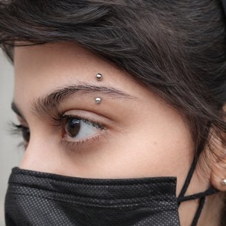 lips and facial piercing in peshawar by earstudex