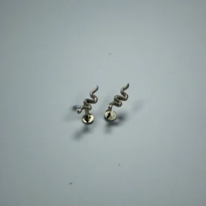 Snake design ear stud featuring a sleek serpent shape with detailed craftsmanship, elegant finish, and modern bold style for women.