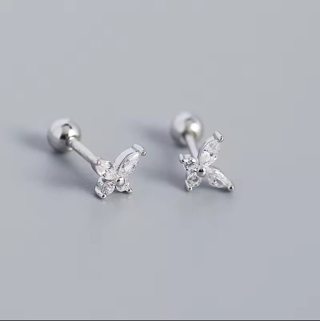 Close-up of a delicate 925 sterling silver butterfly ear stud. A single, hypoallergenic earring designed for lobe or cartilage piercings.