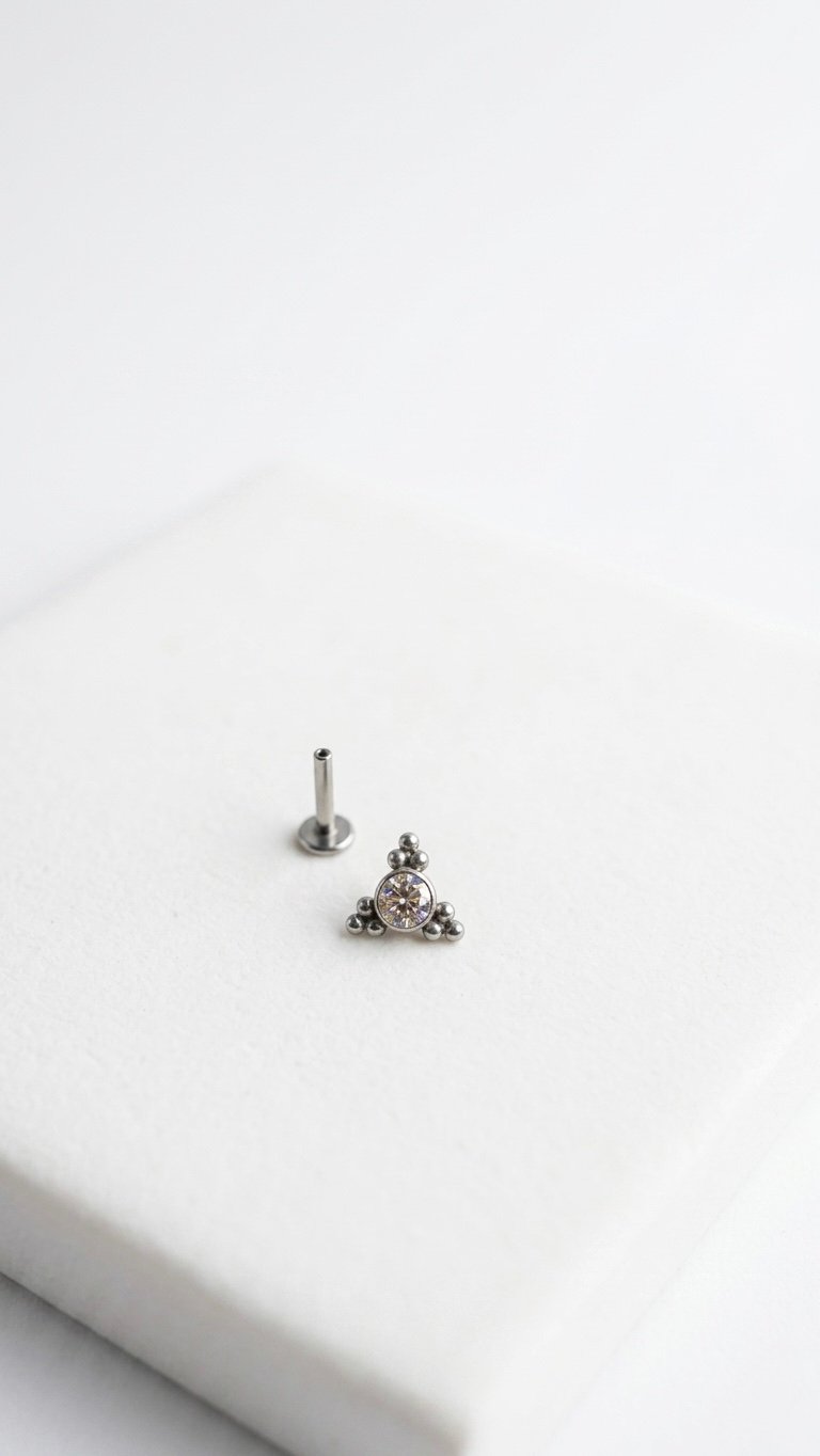 Trinity Cluster Ear Stud featuring three brilliant cubic zirconia stones in hypoallergenic titanium.